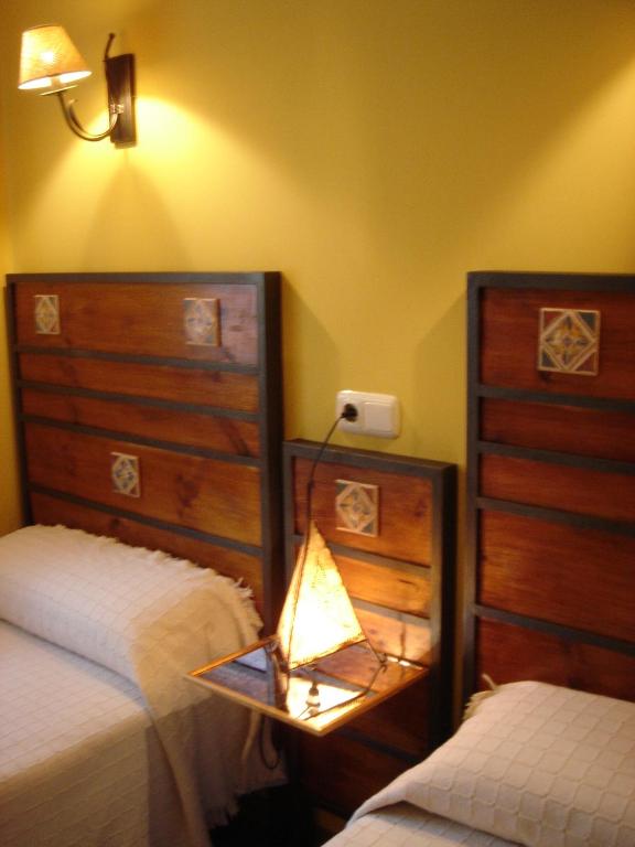 A bed or beds in a room at Fuente de Cella