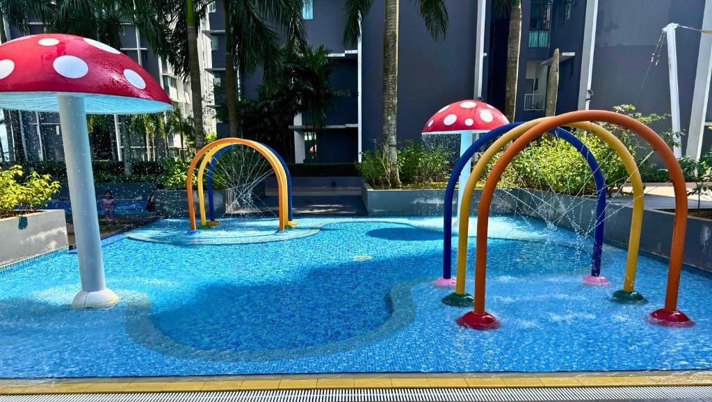 a water park with three slides with mushrooms at Almyra cozy condo in Kajang