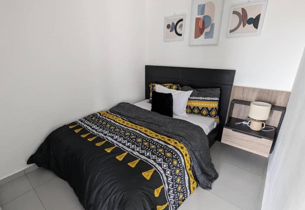 เตียงในห้องที่ Appartement Confort Plus