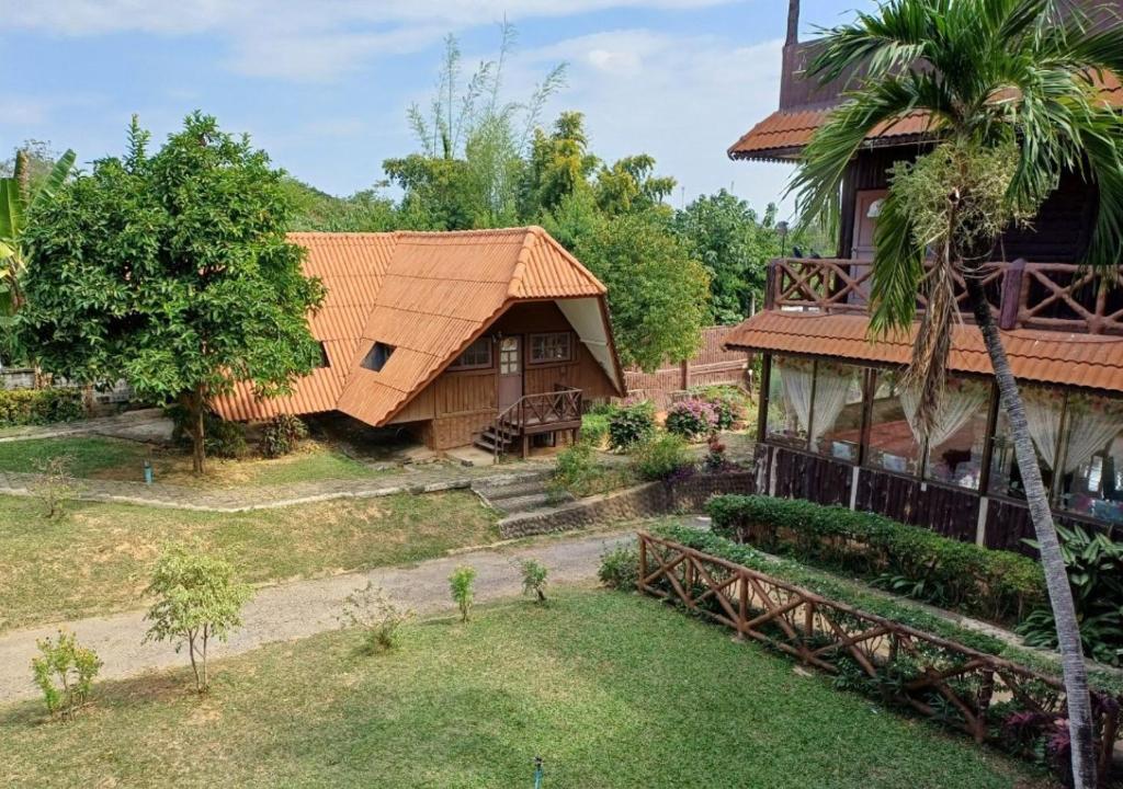 an aerial view of a house with a palm tree at สายชลวิว ริเวอร์แคว in Ban Wang Yen