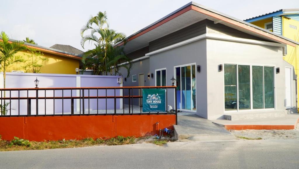 a building with a sign in front of it at Tiny house bangtao phuket in Ban Thalat Choeng Thale