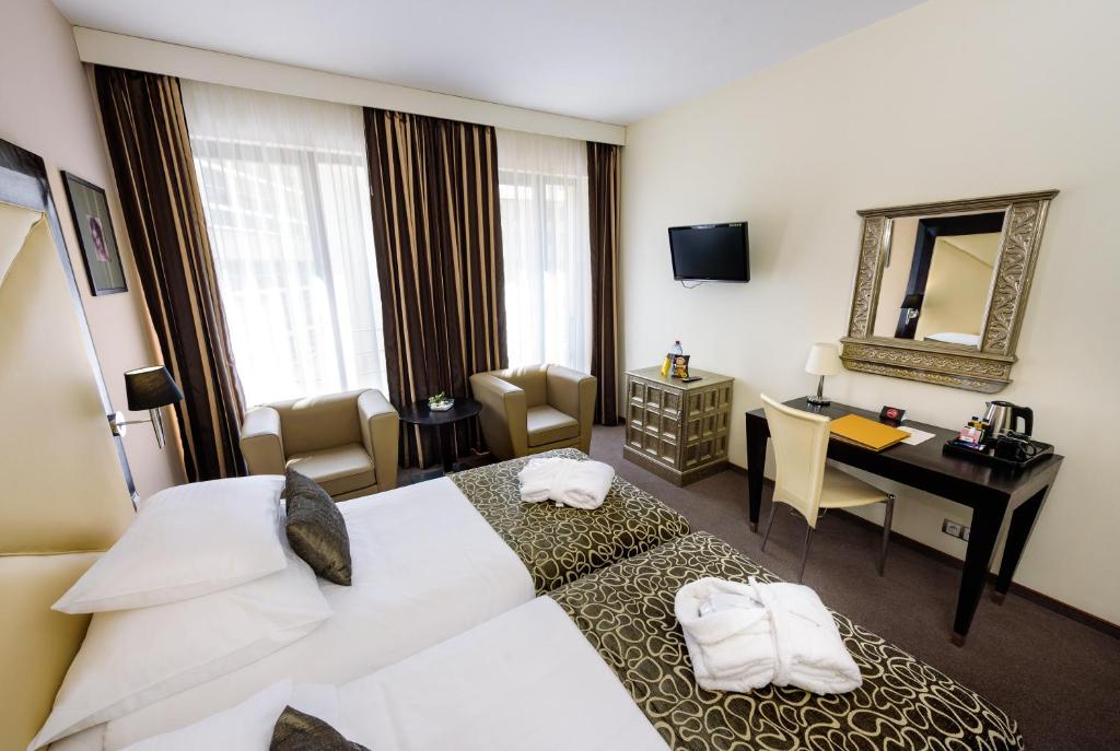 Postel nebo postele na pokoji v ubytování Grandior Hotel Prague