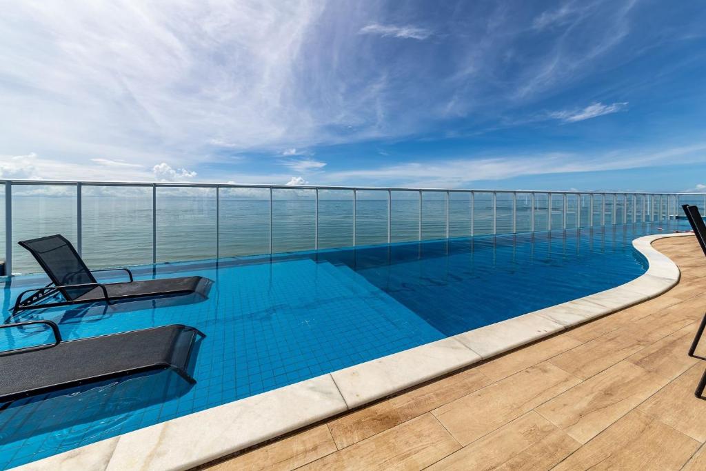 a swimming pool on the roof of a building at RN Studio Premium – Your Seaside Retreat in Maceió