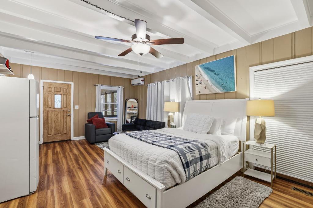 a bedroom with a bed and a ceiling fan at Spacious comfortable Studio Unit in Tallahassee