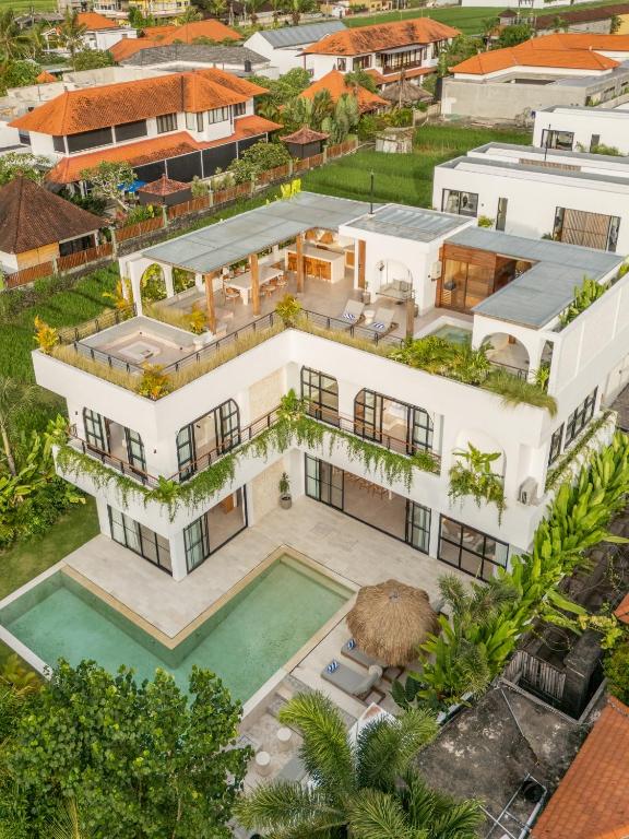 an aerial view of a mansion with a swimming pool at Sapta Cemagi - Villa Deluna in Cemagi