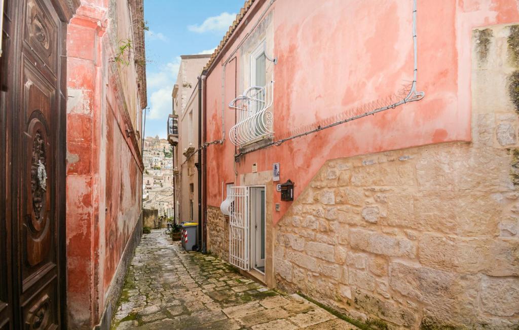 an alley in an old town with buildings at Casa Herea in Ragusa