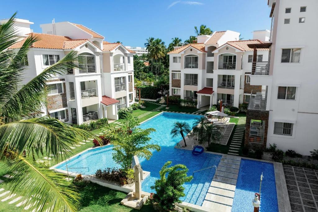 an overhead view of a swimming pool in a apartment complex at Corte Sea A302, Luxury Penthouse in Punta Cana