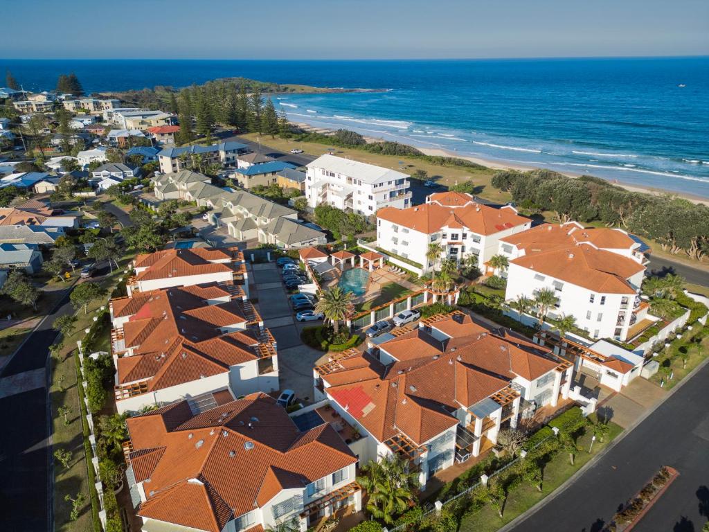 an aerial view of a resort near the ocean at The Breakers Yamba in Yamba