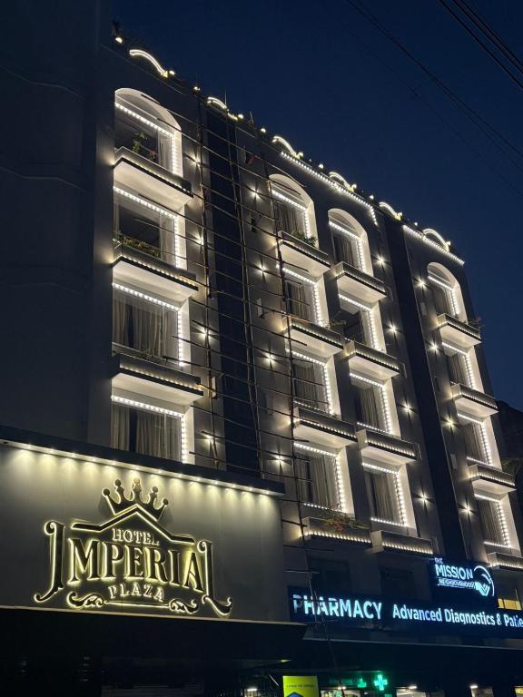 a large building with a sign in front of it at Hotel Imperial Plaza Asansol in Āsansol