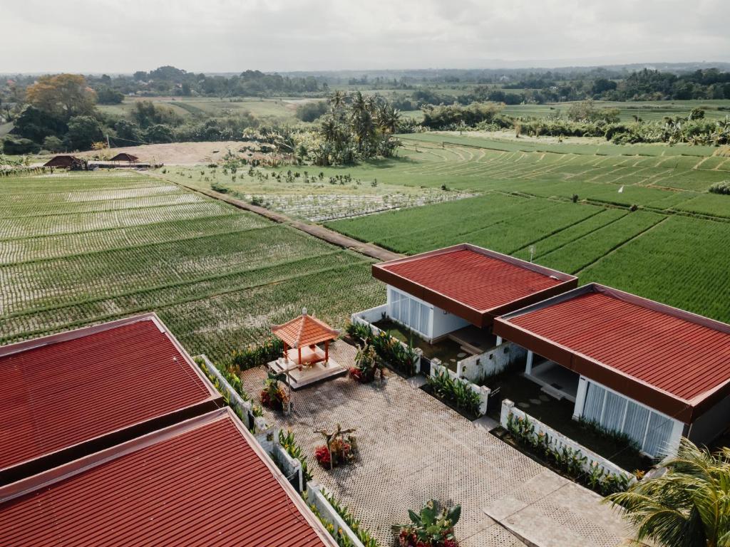 an aerial view of a house with red roof at Taman Villa Kelating in Krambitan