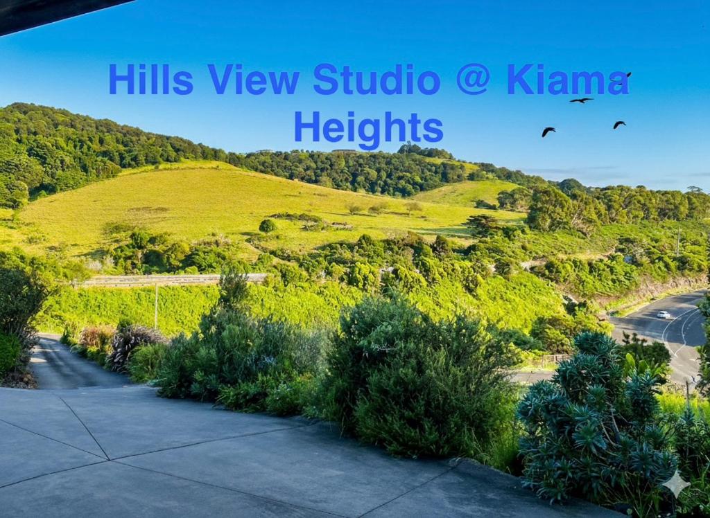 a view of a hill with trees and a road at Hills View Studio Kiama Heights in Kiama