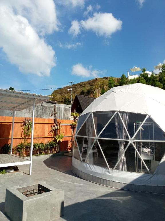 a building with a tent on a patio at Sangkuriang 1 - Private Dome in Bandung