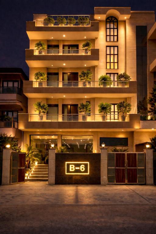 a building with a sign in front of it at Hotel Prime Stay in Noida