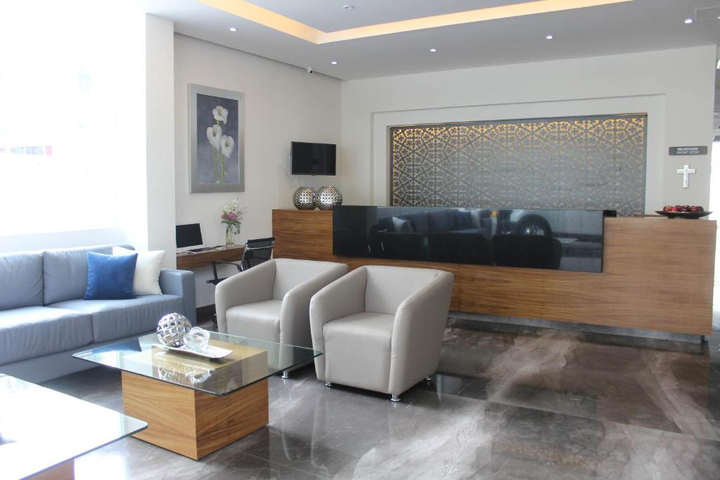 TV a/nebo společenská místnost v ubytování Eco Hotel Guadalajara Expo