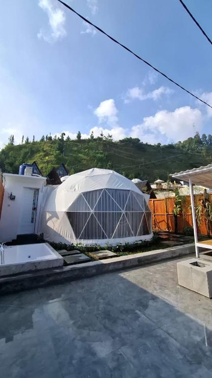 a greenhouse on the roof of a house at Sangkuriang 2 - Private Dome in Bandung