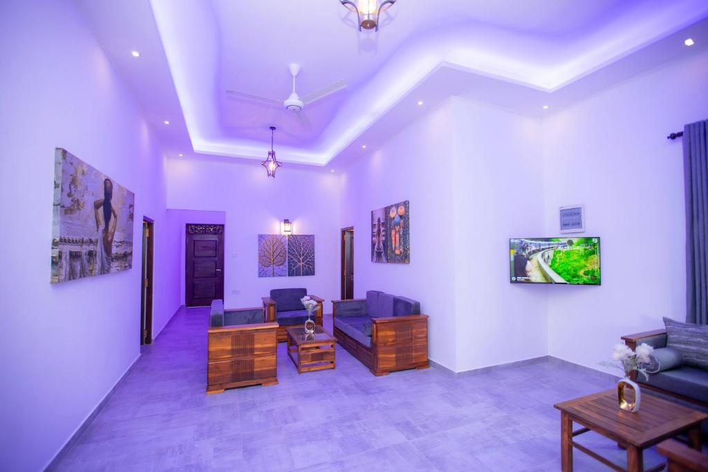 a living room with a couch and a table at The Lux Villa in Habaraduwa Central