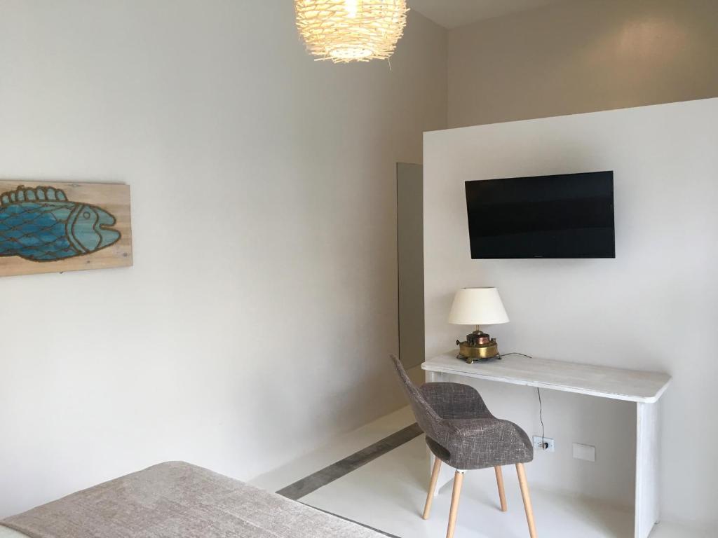 TV a/nebo společenská místnost v ubytování La Ramona Charming Hotel