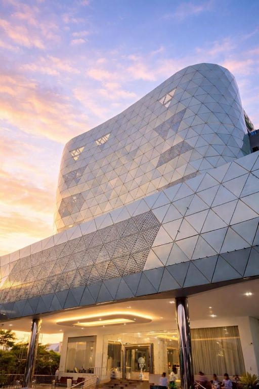 a building with a pyramid like facade with a sky at Morakot Twin Chumphon in Chumphon