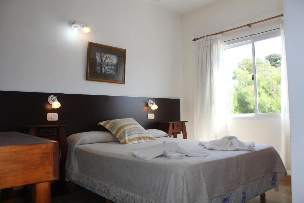 Cama ou camas em um quarto em Hotel Boiano