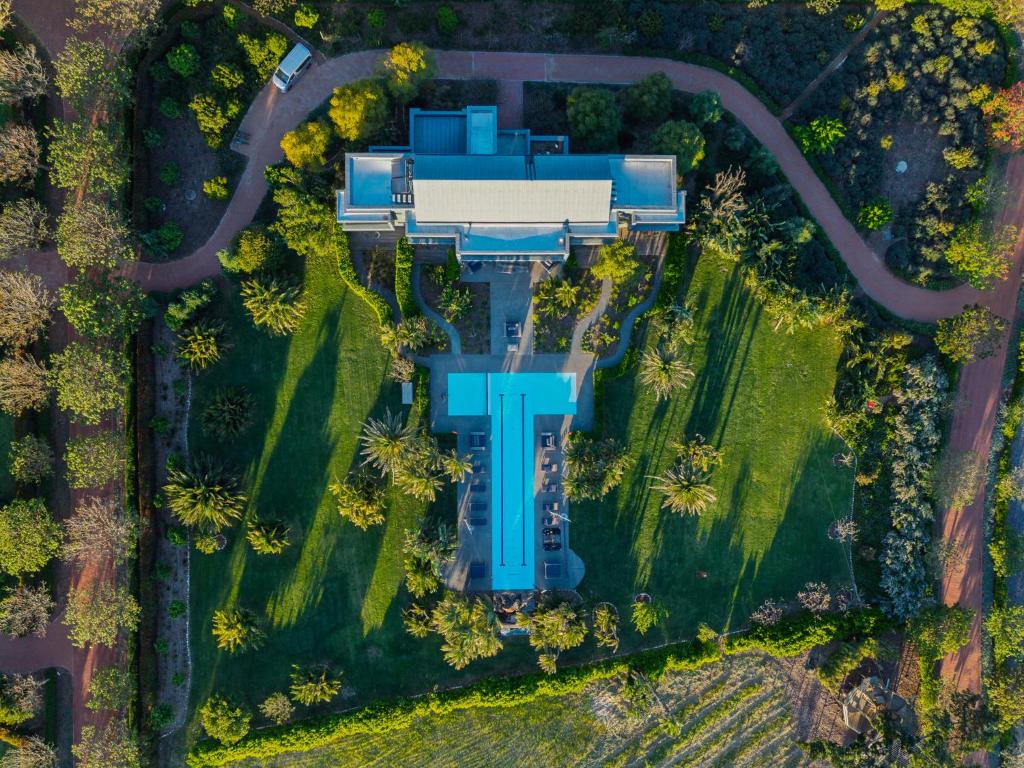 an overhead view of a house with a building at Ludus Magnus Boutique Hotel in Franschhoek