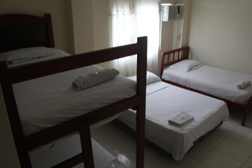 Postel nebo postele na pokoji v ubytování Hostal Rosa Mar