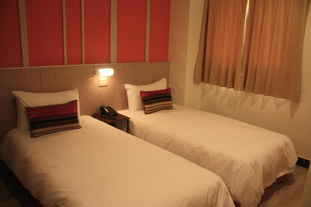 Postel nebo postele na pokoji v ubytování Prince Hotel