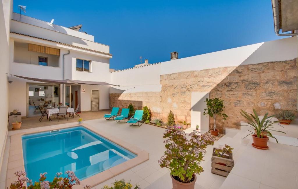 a villa with a swimming pool and a house at Foners Mallorquins in Muro