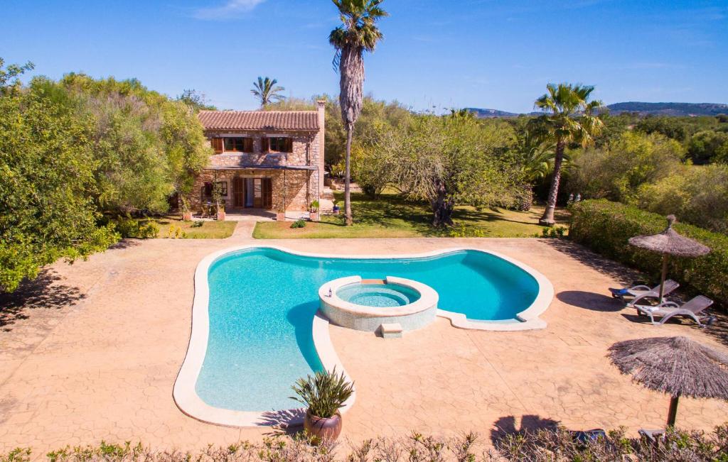 an image of a swimming pool in front of a house at Mirabo Ramonet in Felanitx