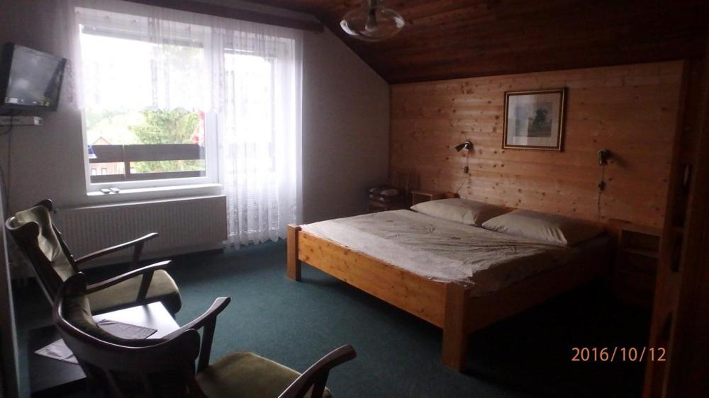 Postel nebo postele na pokoji v ubytování Dům Jaroslava
