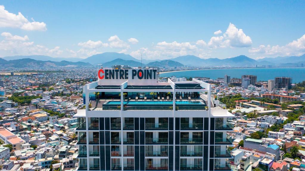 a building with a centre point sign on top of it at Centre Point Da Nang City Hotel - Afternoon Tea Inclusive in Danang