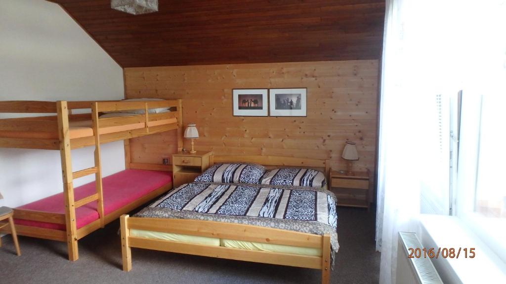 Postel nebo postele na pokoji v ubytování Dům Jaroslava
