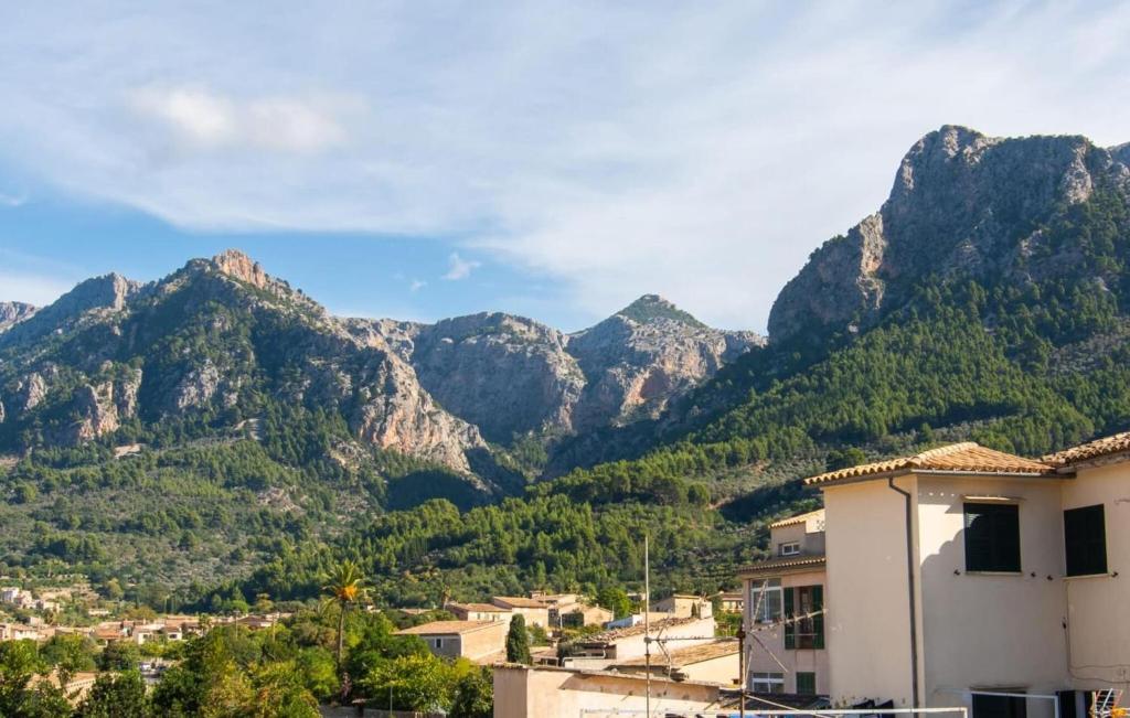 a mountain view of a town with houses and mountains at C'as Pobres in Sóller
