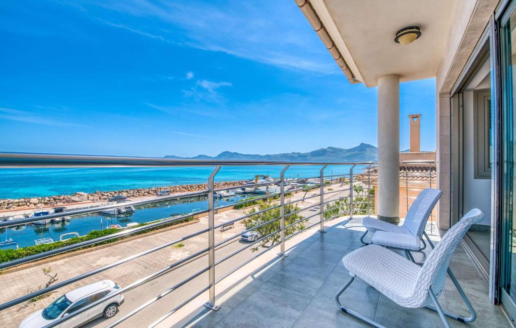 a balcony with chairs and a view of the ocean at Bohemi in Son Serra de Marina