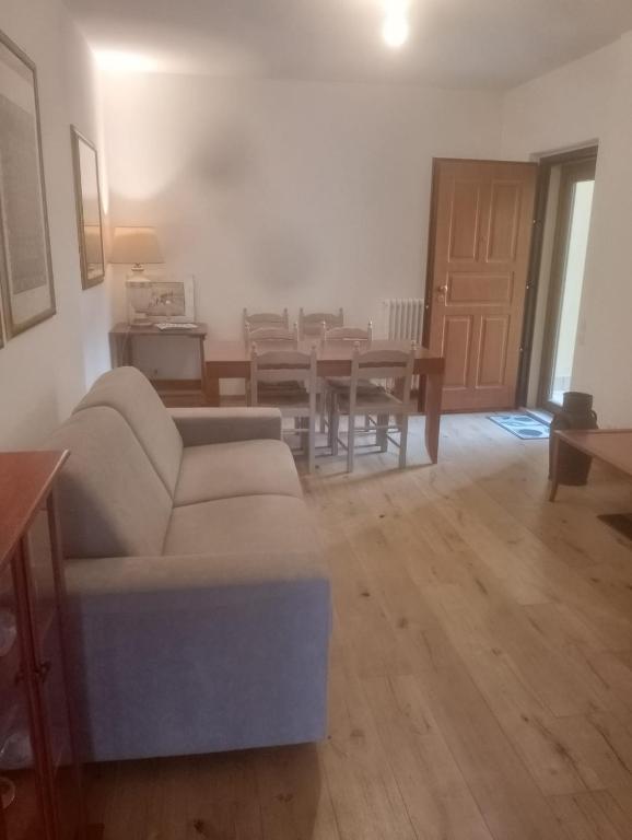 a living room with a couch and a table at Casa Di Leonardo in Loreto