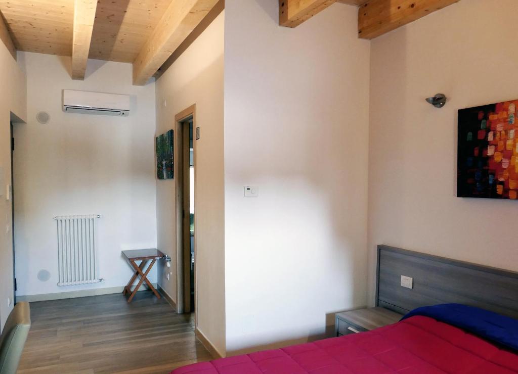 Łóżko lub łóżka w pokoju w obiekcie B&B Il Campanile