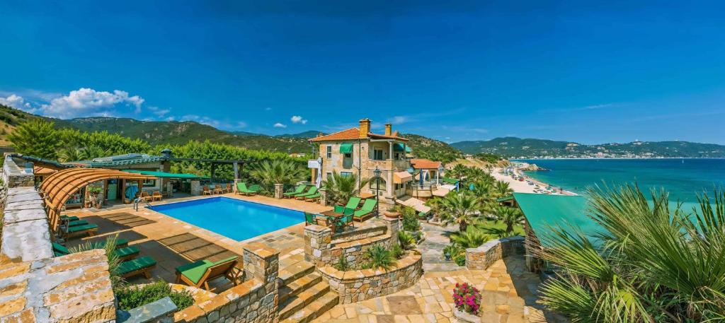 an aerial view of a house with a swimming pool and a beach at Talizeti Home - Adults Only in Sarti