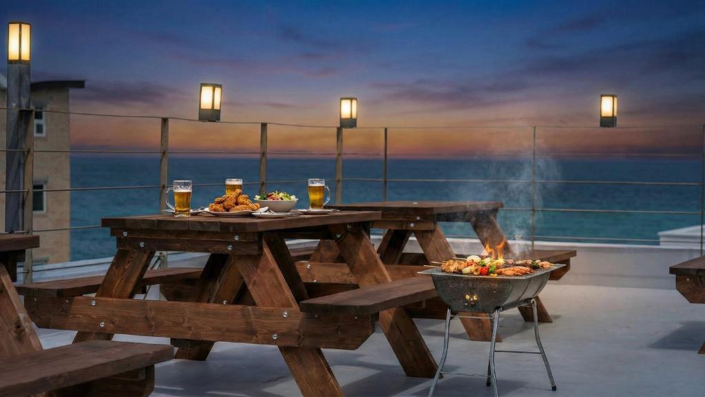 a picnic table with a bowl of food on a balcony at Samcheok jangho sanho Pension in Samcheok