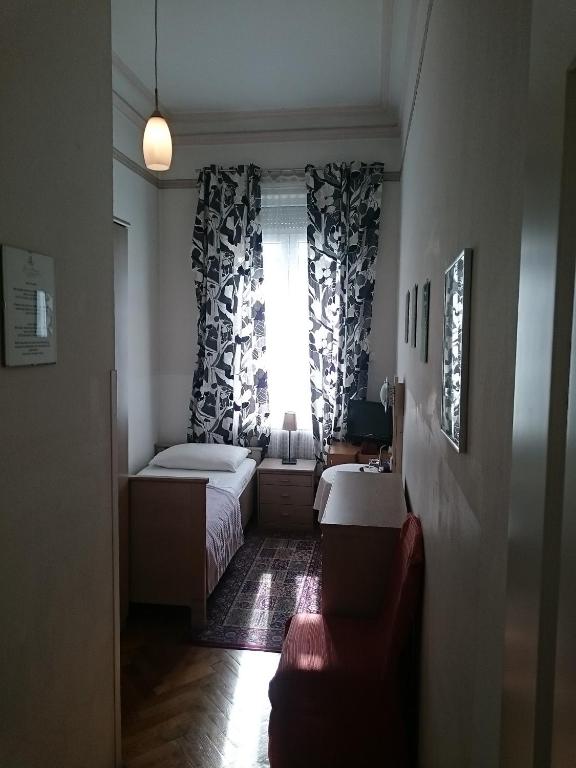 Postel nebo postele na pokoji v ubytování Hotel Stadtpark