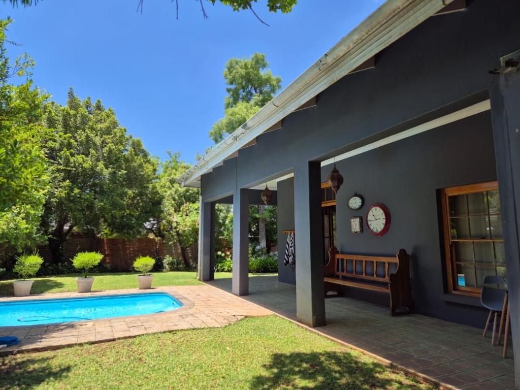 a house with a swimming pool in a yard at 12 On Milner in Kimberley