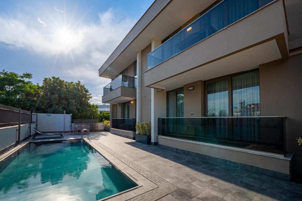 an image of a house with a swimming pool at Moon Shine Apart in Altınkum