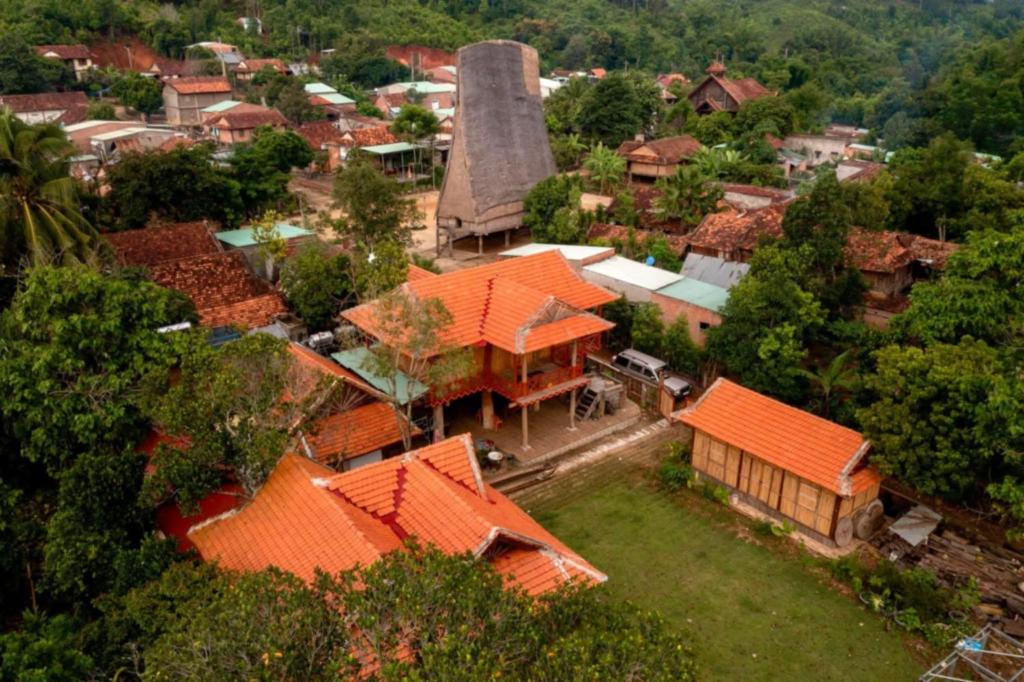 an overhead view of a village with orange roofs at A Vũ Homestay & Coffee in Kon Cho Dri