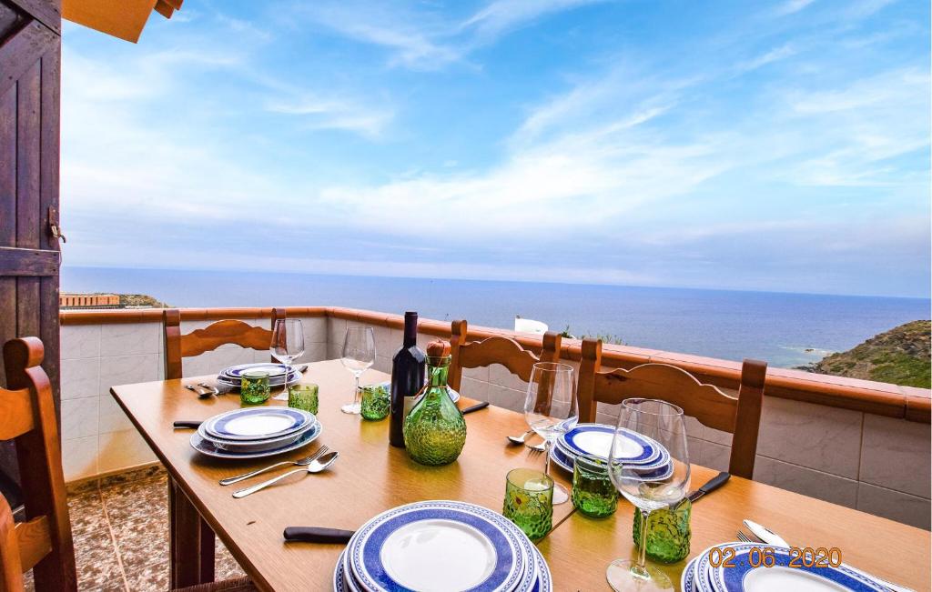 a table on a balcony with a view of the ocean at Casa Mario in Torre Dei Corsari