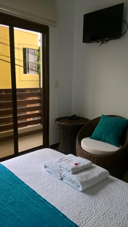 TV a/nebo společenská místnost v ubytování Hostal Costa del Pacifico