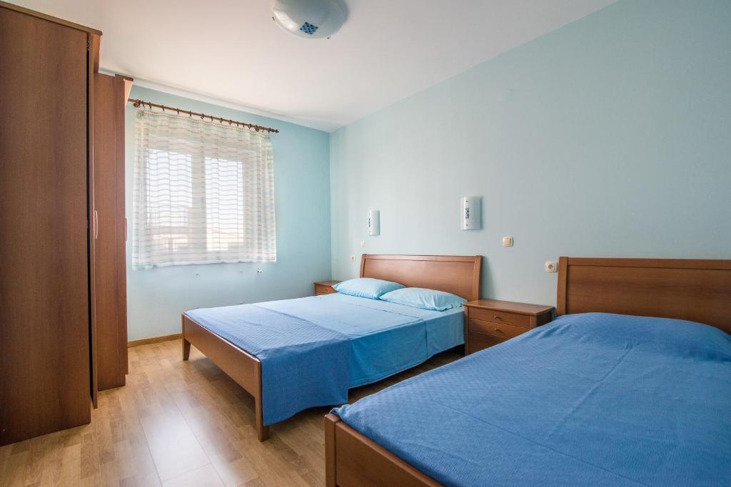 Postel nebo postele na pokoji v ubytování Apartments Luci and Kety