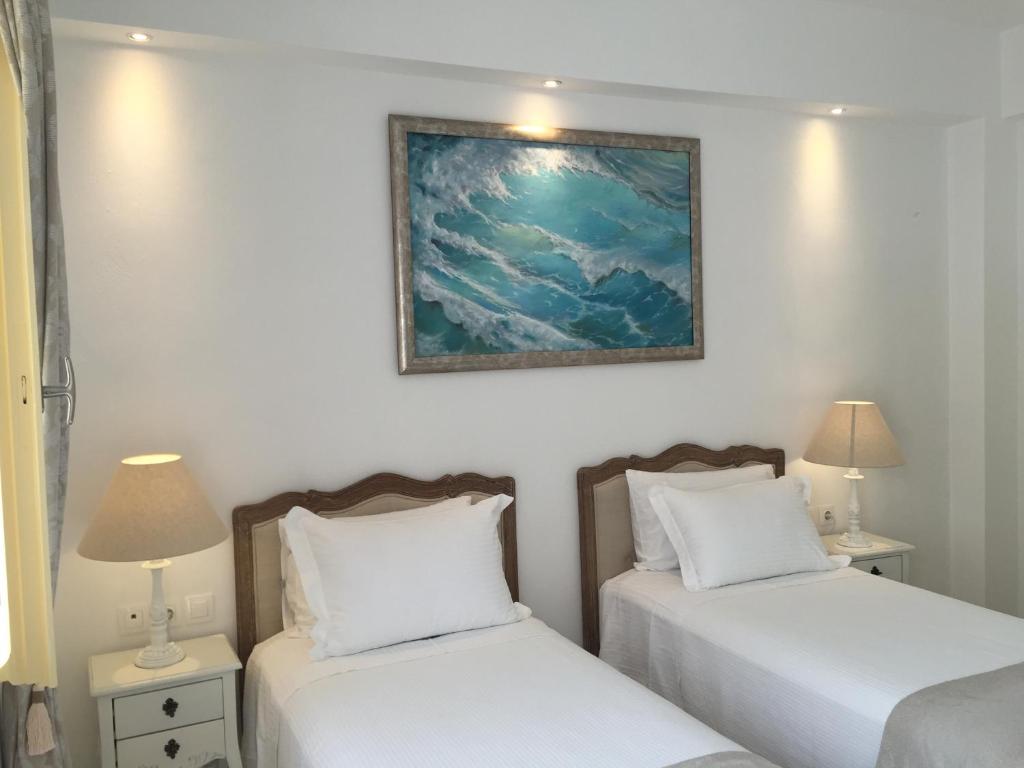 Posteľ alebo postele v izbe v ubytovaní The White Suites