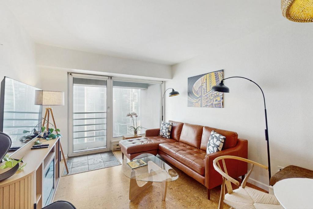 a living room with a couch and a table at Pike Place Pearl in Seattle