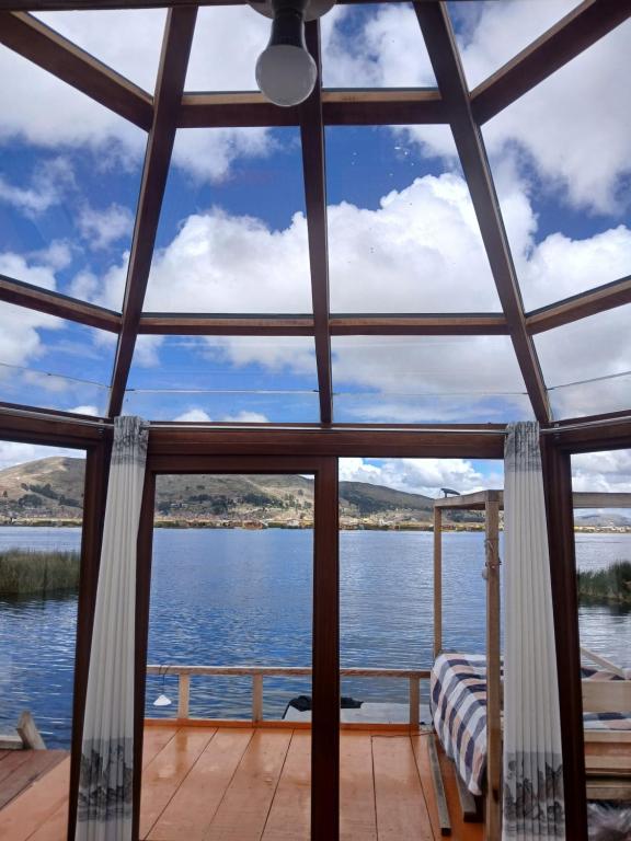 a view of the water from the porch of a boat at Uros Titicaca coila lodge in Puno