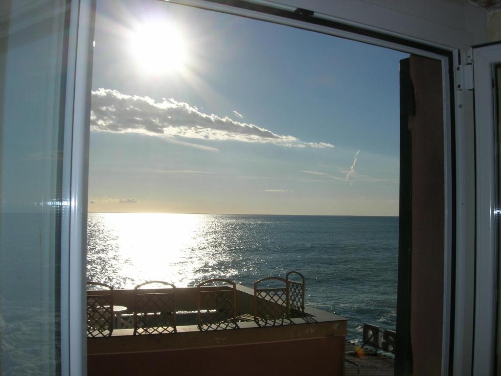 a view of the ocean from a balcony at Romantic Sea View Flat in Genova in Genoa
