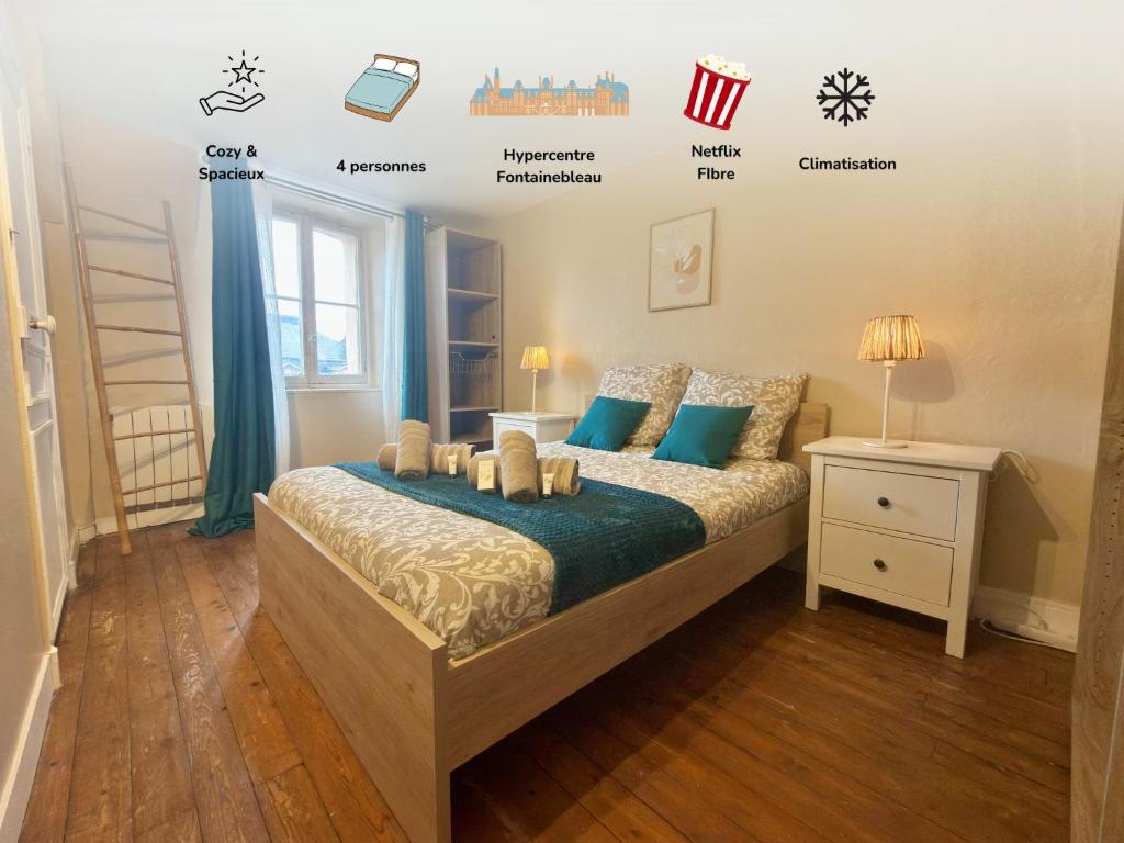 a bedroom with a bed and a wall with labels at Hypercentre Fontainebleau -Tout confort 2 chambres in Fontainebleau