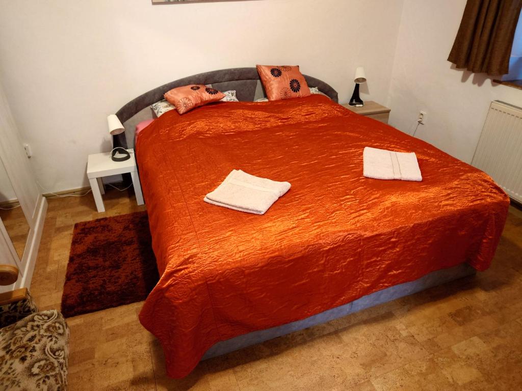 a bed with two stuffed animals on top of it at Zukalka 2KK - 1 in Ostrava